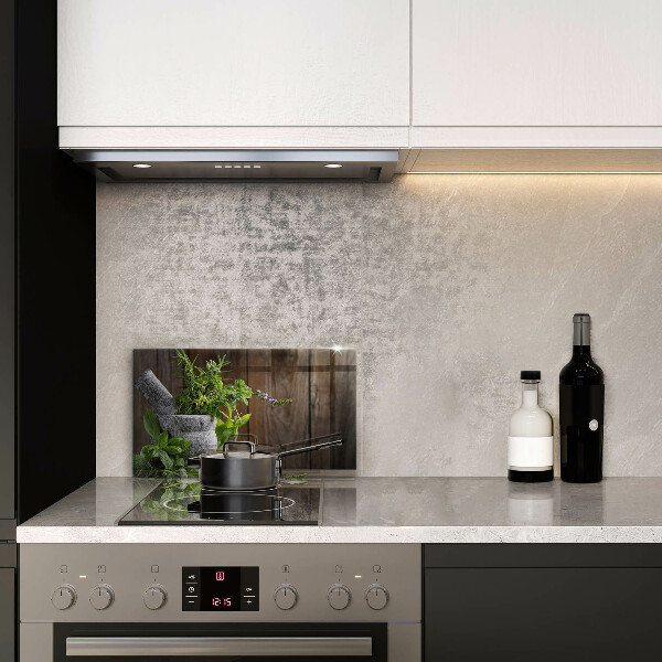 Skleněná deska do kuchyně Pěstuje bylinky a dřevo