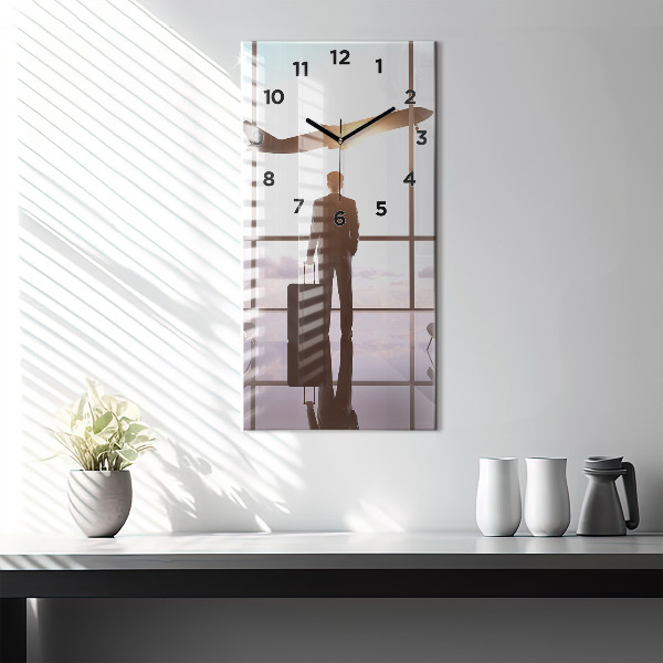 Vertikální skleněné hodiny Muž na letišti