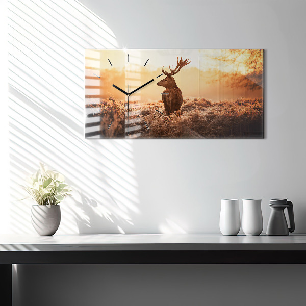 Horizontální hodiny na skle Jelen při východu slunce