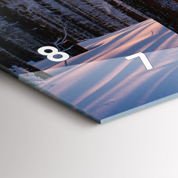 Horizontální hodiny na skle Les při západu slunce