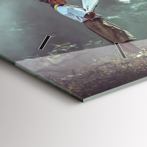 Horizontální skleněné hodiny na stěnu Chlapec si čte knihu