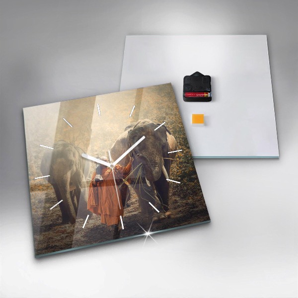 Čtvercové nástěnné hodiny Mnich vedoucí slony