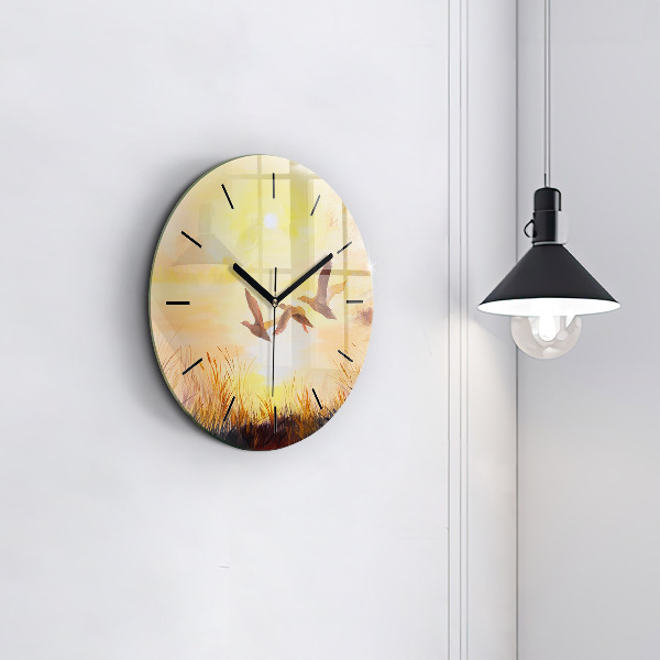 Kulaté skleněné hodiny s fotkou Jeřábi při západu slunce