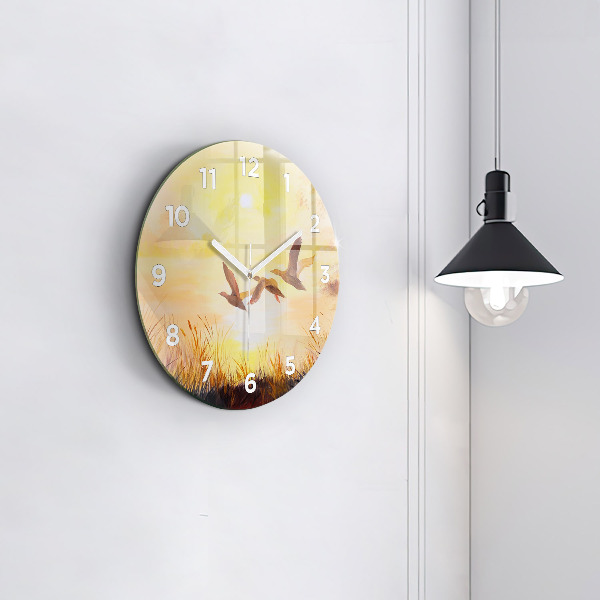 Kulaté skleněné hodiny s fotkou Jeřábi při západu slunce