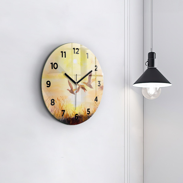 Kulaté skleněné hodiny s fotkou Jeřábi při západu slunce