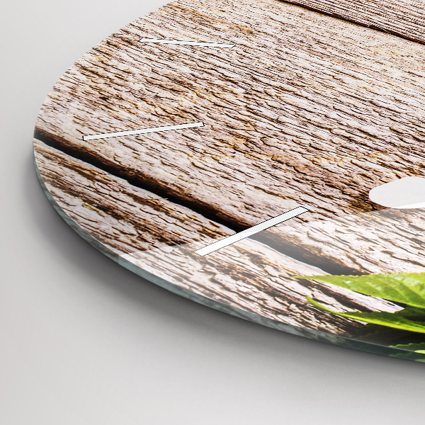 Kulaté skleněné hodiny s fotkou Květiny na dřevě