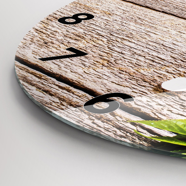 Kulaté skleněné hodiny s fotkou Květiny na dřevě