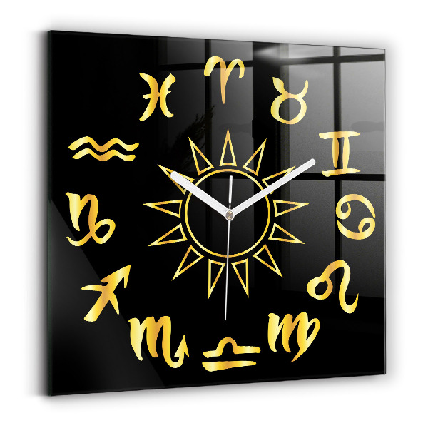 Skleněné nástěnné hodiny Zlatá astrologická znamení na černém pozadí.
